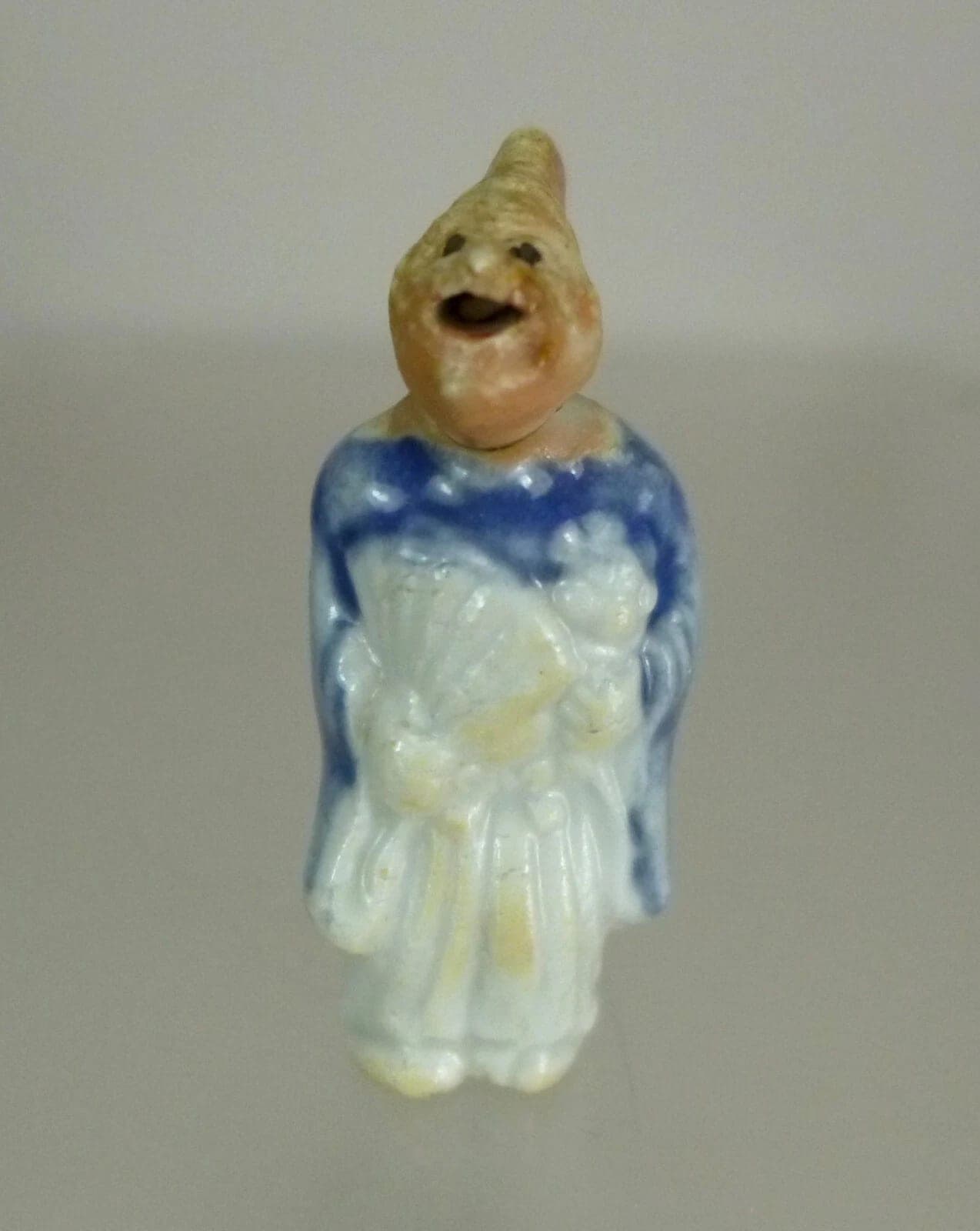 KARAKURI HIRADO PORCELAIN NETSUKE OF A MONKEY AS A SAMBASO DANCER