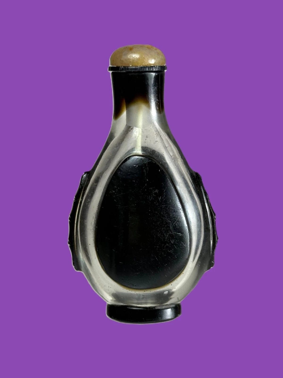AN UNUSUAL BLACK OVERLAY COLORLESS GLASS SNUFF BOTTLE, QING DYNASTY