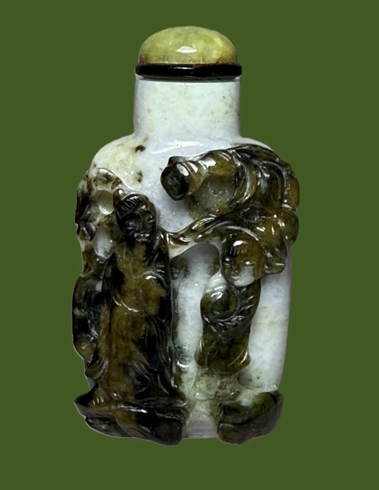 Qing Dynasty, White Jade with dark-skin Carvings Snuff Bottle